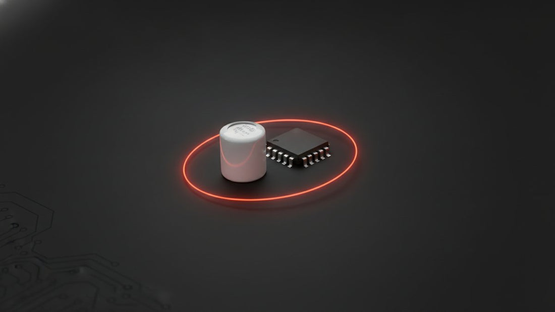 Ceramic capacitor beside a microcontroller chip on dark background