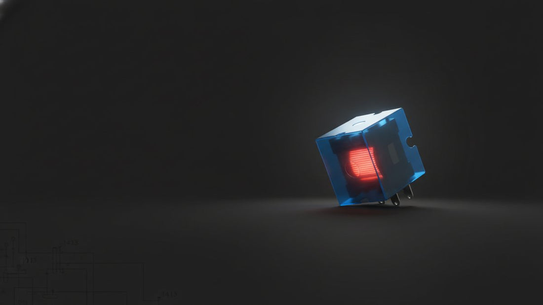 Relay module cube showing its coil on dark background